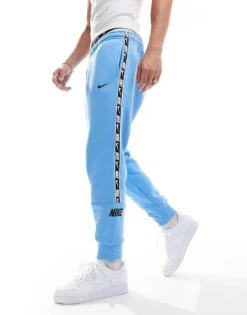 Nike Repeat Logo Joggers In Blue For Men Mid Blue