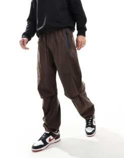 Nike Tech Woven Oversized Fit Trousers In Brown For Men -Nike Sales Store 206615573 1 brown 1