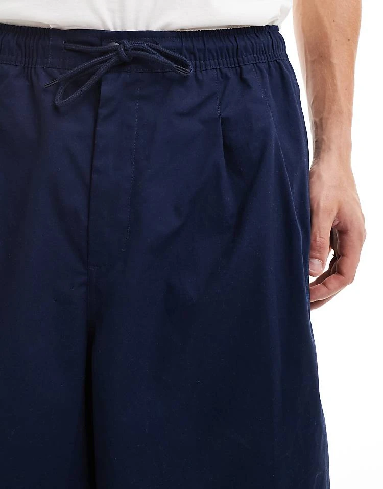 Nike Club Woven Balloon Oversized Trousers In Navy For Men 7 Nike Club Woven Balloon Oversized Trousers In Navy For Men - Image 5