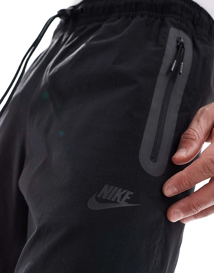 Nike Tech Woven Open Hem Trousers In Black For Men 6 Nike Tech Woven Open Hem Trousers In Black For Men - Image 4