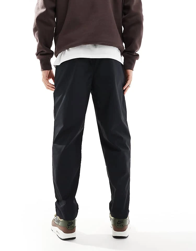 Nike Club Woven Tapered Trousers In Black For Men 6 Nike Club Woven Tapered Trousers In Black For Men - Image 4